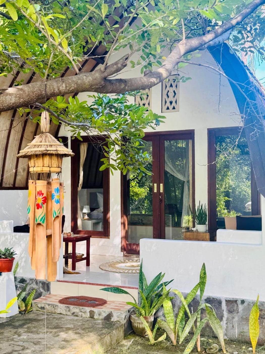 Bungalow entrance with bamboo chimes