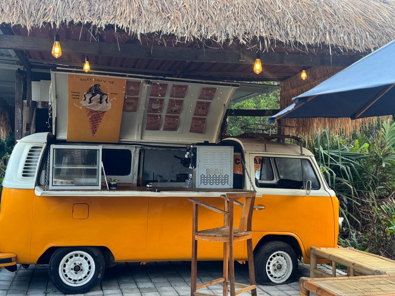 Yellow VW combi cafe van at Rising Sun Bungalows — opening soon